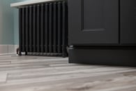 Painted floor heater contrasting beautiful hardwood floors
