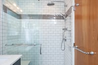 Classic white subway tile make a small bathroom feel larger