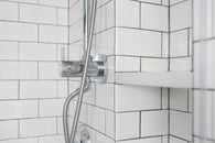 Classic white subway tile make a small bathroom feel larger