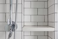 Classic white subway tile make a small bathroom feel larger
