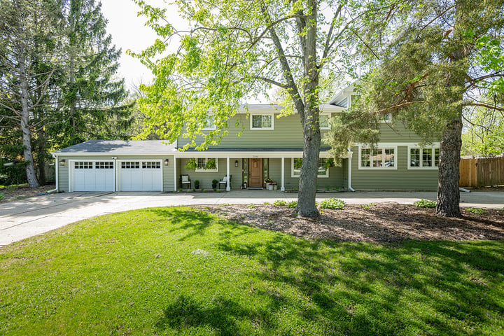 New home addition in Libertyville, Illinois with a new studio space downstairs and a primary suite, bathroom, and laundry upstairs.