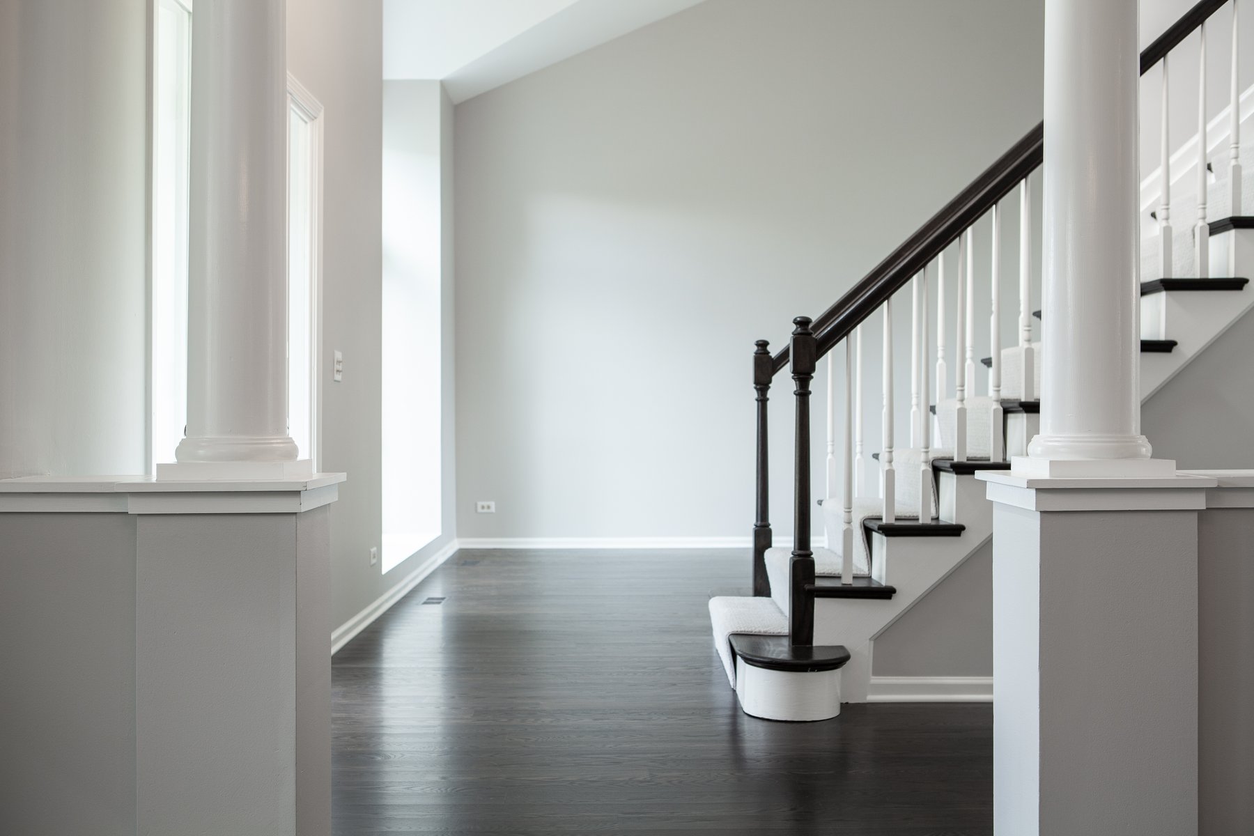 Beautiful modern home remodel in Lake Zurich with natural wood floors, white accents and modern lighting.