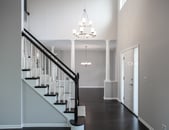 Beautiful modern home remodel in Lake Zurich with natural wood floors, white accents and modern lighting.