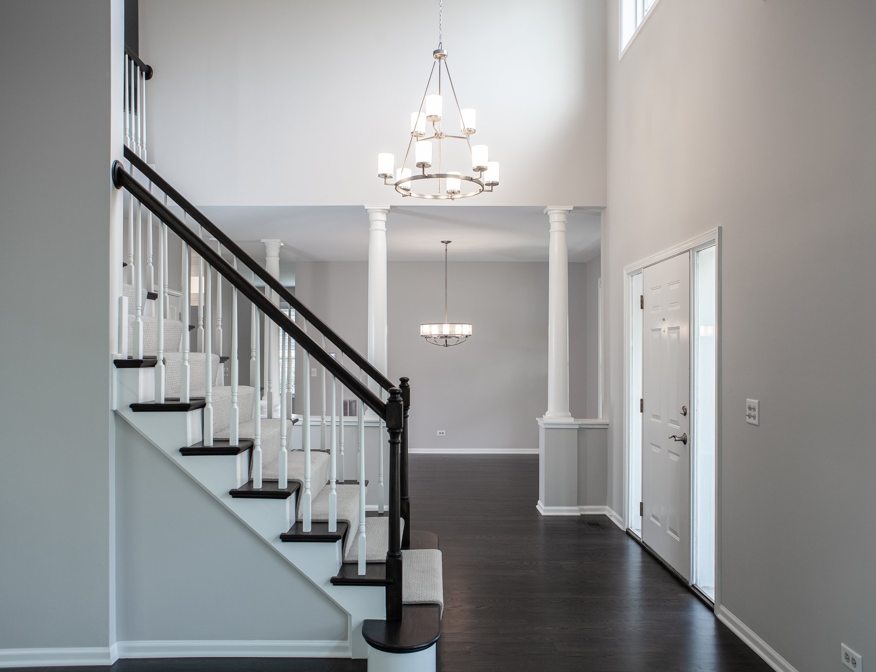 Beautiful modern home remodel in Lake Zurich with natural wood floors, white accents and modern lighting.
