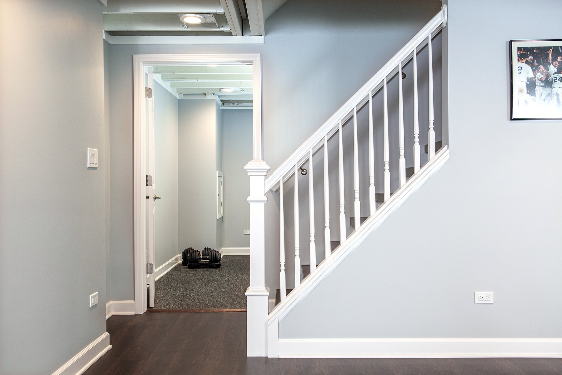 Remodeled basement in Libertyville, Illinois with hardwood floors.