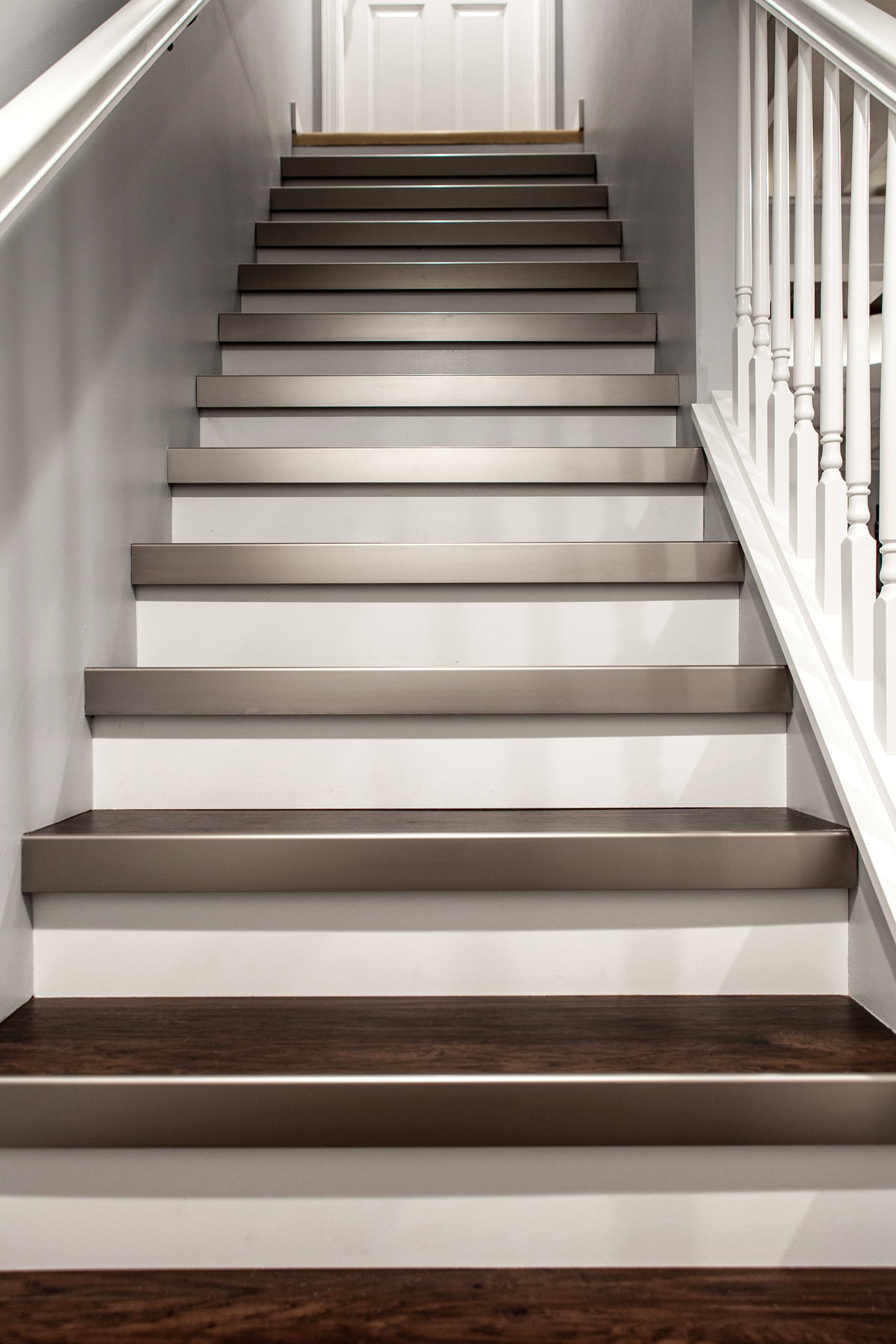 Remodeled basement in Libertyville, Illinois with hardwood floor stairwell.