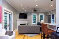 Medium gray walls and light wood flooring make for a classic, yet, modern look in this Libertyville home remodel.