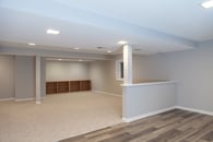 basement remodel with carpet and engineered wood flooring