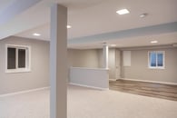 basement remodel with carpet and engineered wood flooring