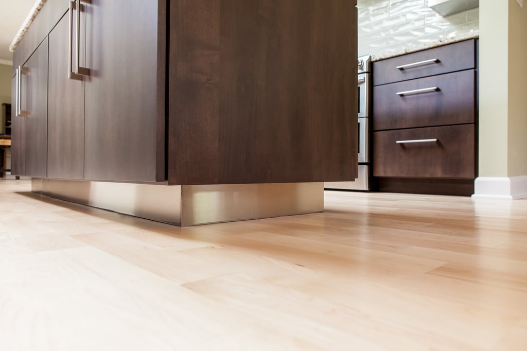 Light hardwood flooring and manicured cabinetry
