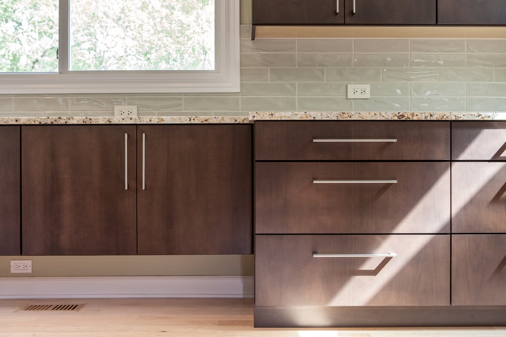 Flat panel cabinetry and subway tile backsplash