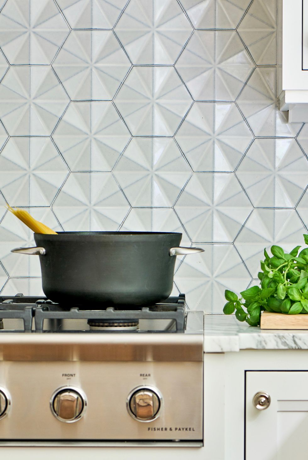 Unique hexagon backsplash tiles.