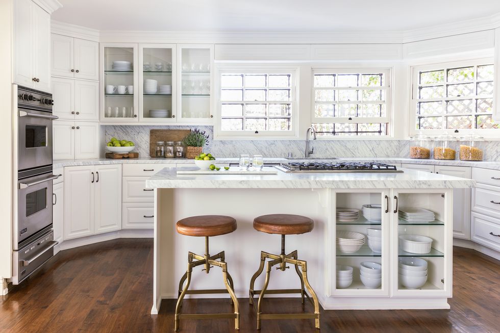 Seamless backsplash white marble tile in a beautiful classic kitchen.