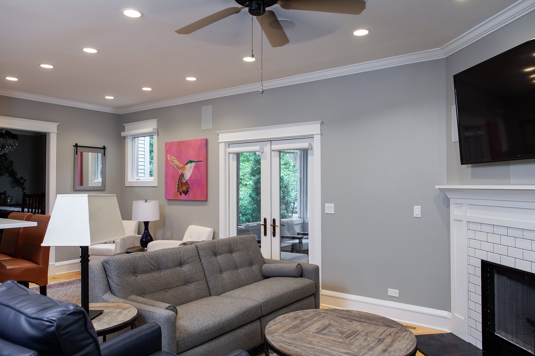 Medium gray walls and light wood flooring make for a classic, yet, modern look in this Libertyville home remodel.